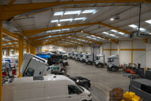 SM UK Workshop in Leeds with several trucks and vans being worked on