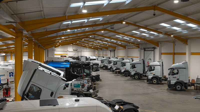 SM UK Workshop in Leeds with several trucks and vans being worked on